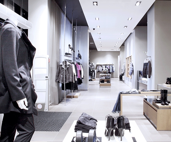 Samsung LEDs a narrow and long fashion store where displays are shone by spot lights