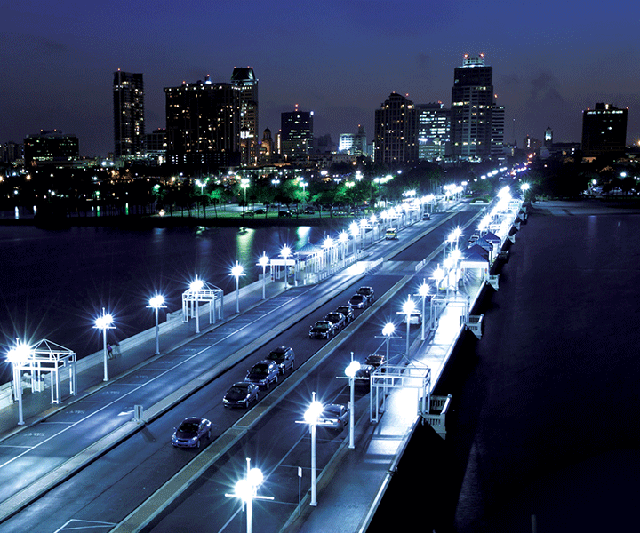 Samsung LEDs an illuminated road bridge at night that traffics are crossing