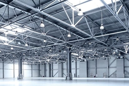  Samsung LEDs a large empty grey storage room lighted up with white high power lights